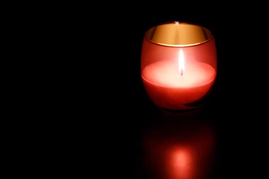 Red candle glass at night