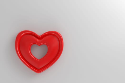 Red heart on white wall