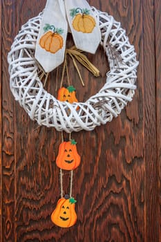 Halloween pumpkin decoration on wooden door