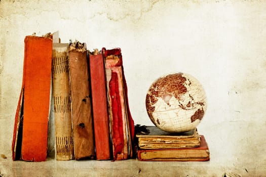 Vintage photo old books and Earth globe
