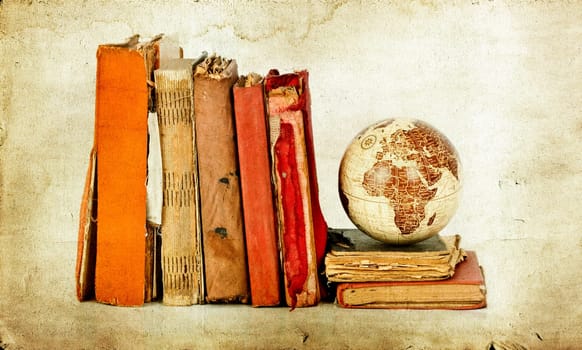 Vintage photo old books and Earth globe