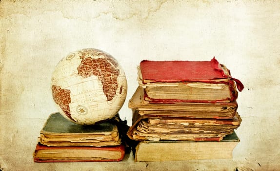 Vintage photo old books and Earth globe
