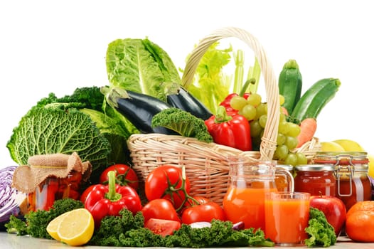 Wicker basket with assorted organic vegetables and fruits isolated on white
