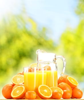 Composition with glasses of orange juice and fruits