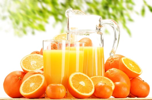 Composition with glasses of orange juice and fruits