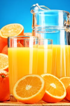 Composition with glasses of orange juice and fruits