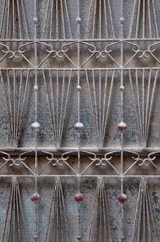 Vintage rusty pattern abstract door grille motif grungy background.