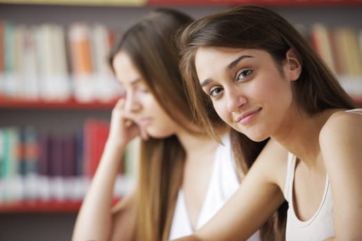 Female College Students in a Library