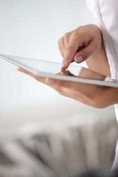 Businesswoman  using his digital tablet, hands close up