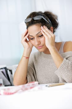 Young businesswoman has a headache