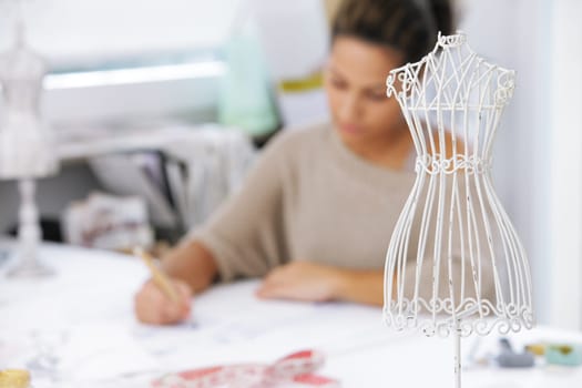 Fashion designer is drawing a fashion model