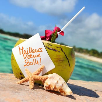 Coconut cocktail starfish tropical Caribbean beach refreshment and towel