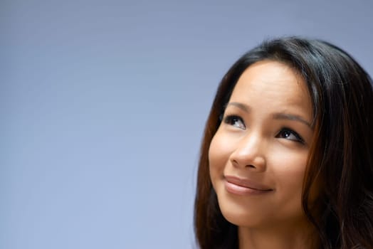 Young people, female teenager, woman, beauty and body care, portrait of happy Asian girl smiling in studio on gray background, copy space