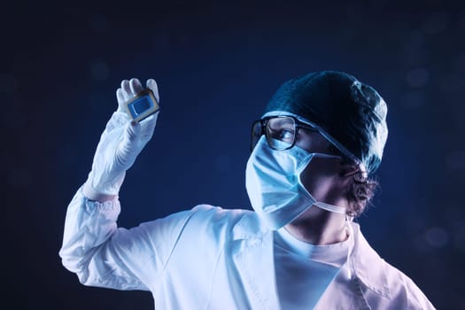 Computer engineer examining a microchip cpu