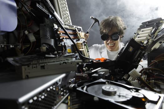 Crazy computer technician is trying to repair a computer