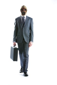 portrait of businessman in a gas mask  with suitcase