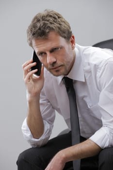 Portrait of a mature business man talking on phone