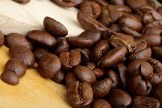 scattered grains of black roasted coffee