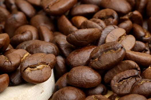 scattered grains of black roasted coffee