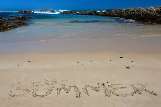 Clean sand and blue sea water at the coast in South Africa