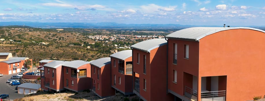 Holiday homes on a hill near Narbonne in the south of France with a view of the valley