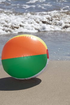 Water polo is located on the beach in the background the sea with waves can be seen