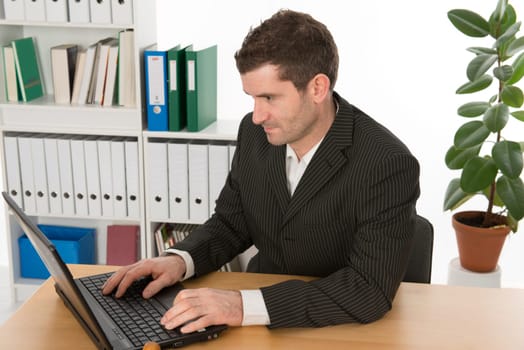 Businessman works with computers