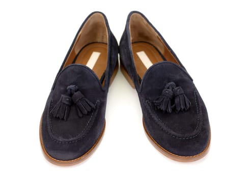 pair of blue suede shoes on a white background.