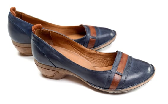 A pair of blue women's leather shoes isolated on white background