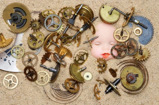 Detail of the clockwork mechanism on the sand and puppy head