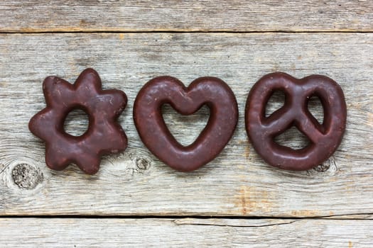 Cookies in a chocolate glaze on a wooden background