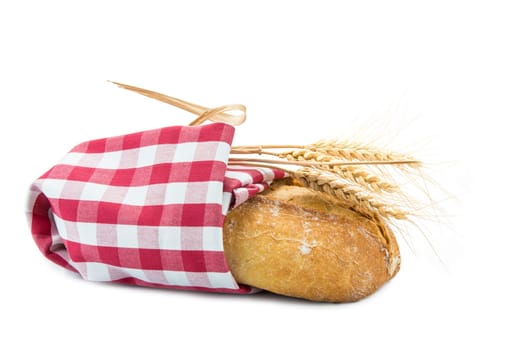 wheat bread covered wit a dishcloth and isolated on a white background