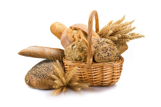 Still life about a basket with a large bread assortment isolated over a white background