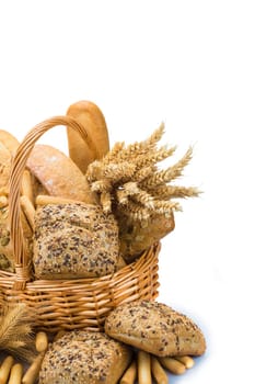 Still life about a basket with a large bread assortment isolated over a white background