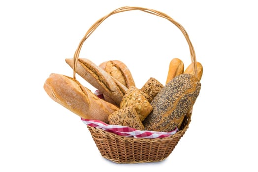 Still life about a basket with a large bread assortment isolated over a white background