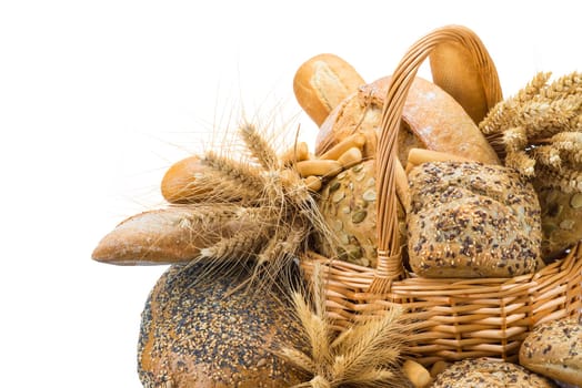Still life about a basket with a large bread assortment isolated over a white background