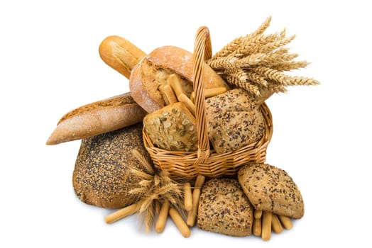 Still life about a basket with a large bread assortment isolated over a white background