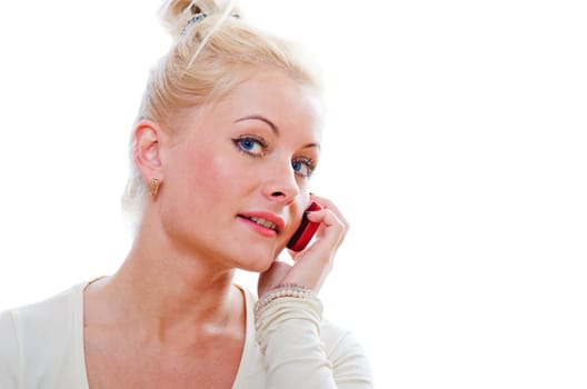 The young woman talks by a mobile phone