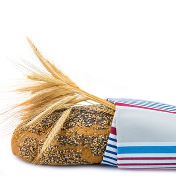 Bread covered with a dishcloth isolated on a white background