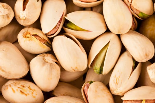 Pistachio nuts close up from above.