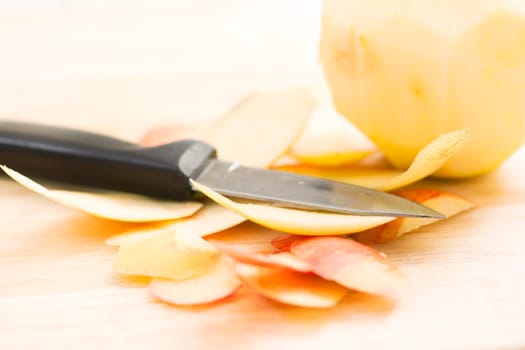 Apple peels with paring knife, shallow depth of field