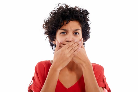 hispanic woman with hands covering mouth, speachless and angry, looking at camera
