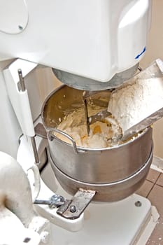 Churning mass of sugar in confectionery machine