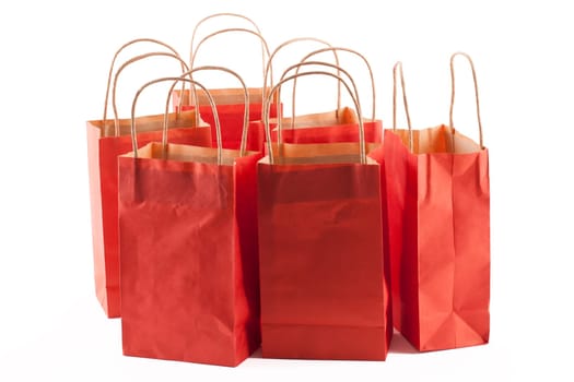 Group of red shopping bags on a white background