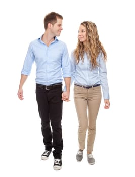 Young romantic couple walking, isolated on white