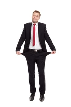 Broke businessman with empty pockets on white