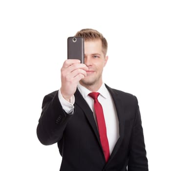 Handsome businessman taking a selfie with a mobile phone