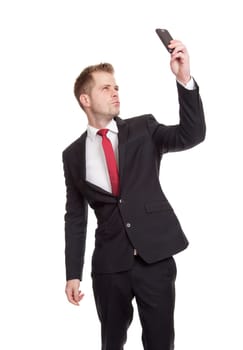 Handsome businessman taking a selfie with a mobile phone