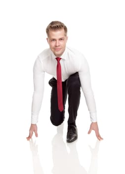 Businessman in starting position ready for chasing deals