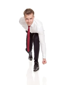 Businessman in starting position ready for chasing deals